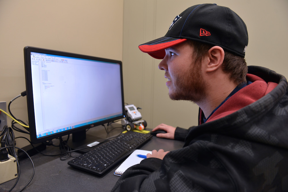 A male student uses a computer